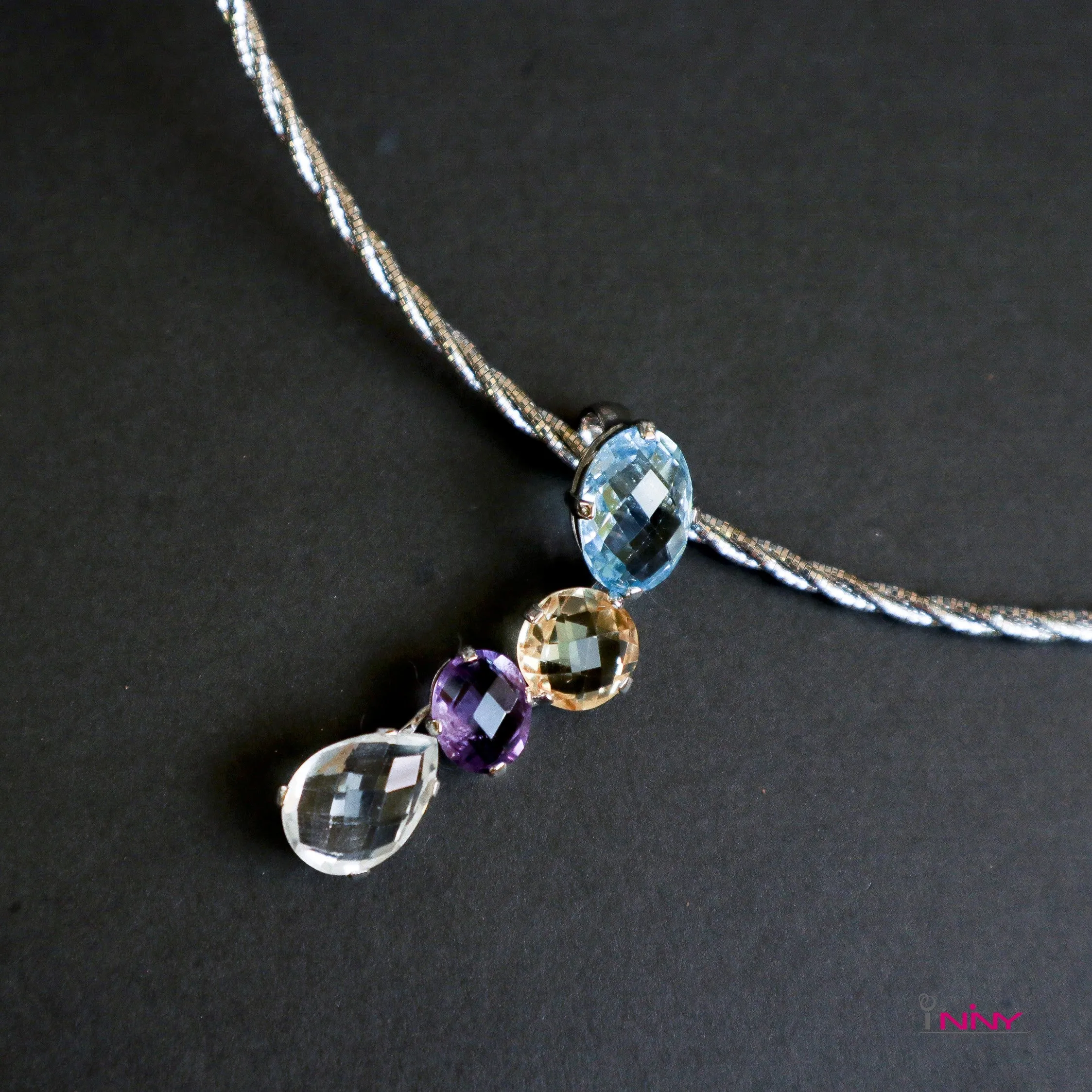 Four mineral gems 7.2g pendant